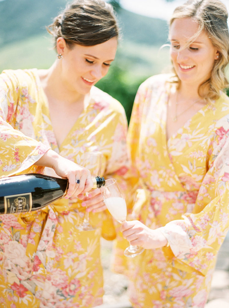 Bride and her Bridesmaids in yellow Pretty Plum Sugar floral robes