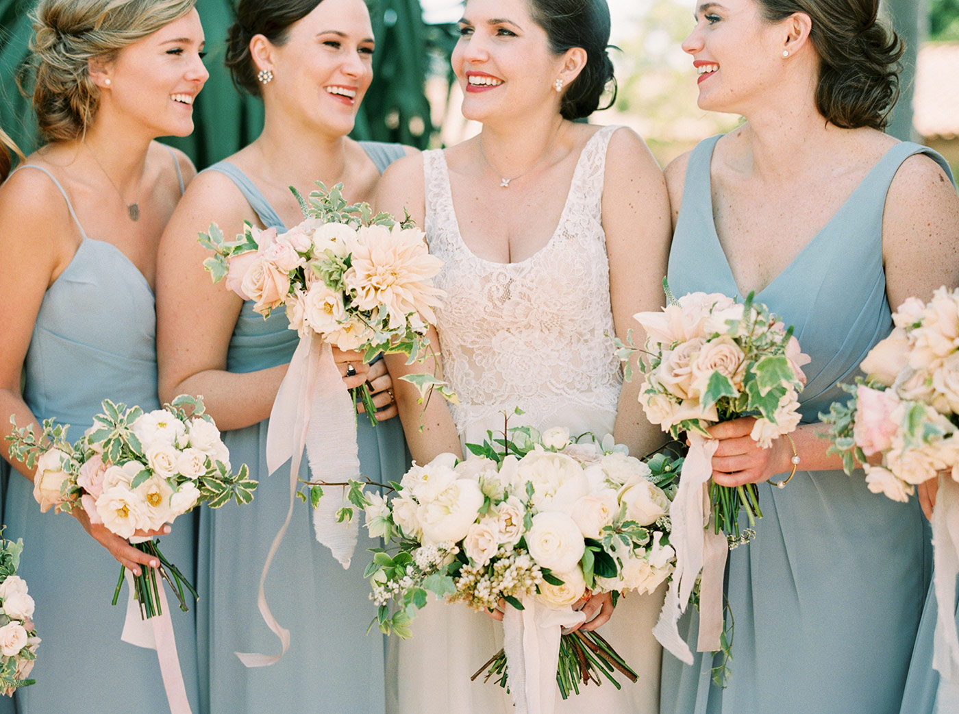 Bride and Bridesmaids with White and Pastel toned bouquets